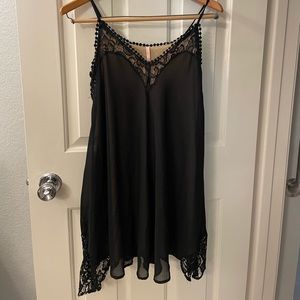 Pre-loved LuLu’s Black strappy swing dress. Size M